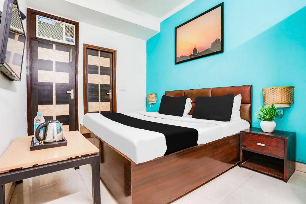 Postel nebo postele na pokoji v ubytování Hotel O KD Plaza 6