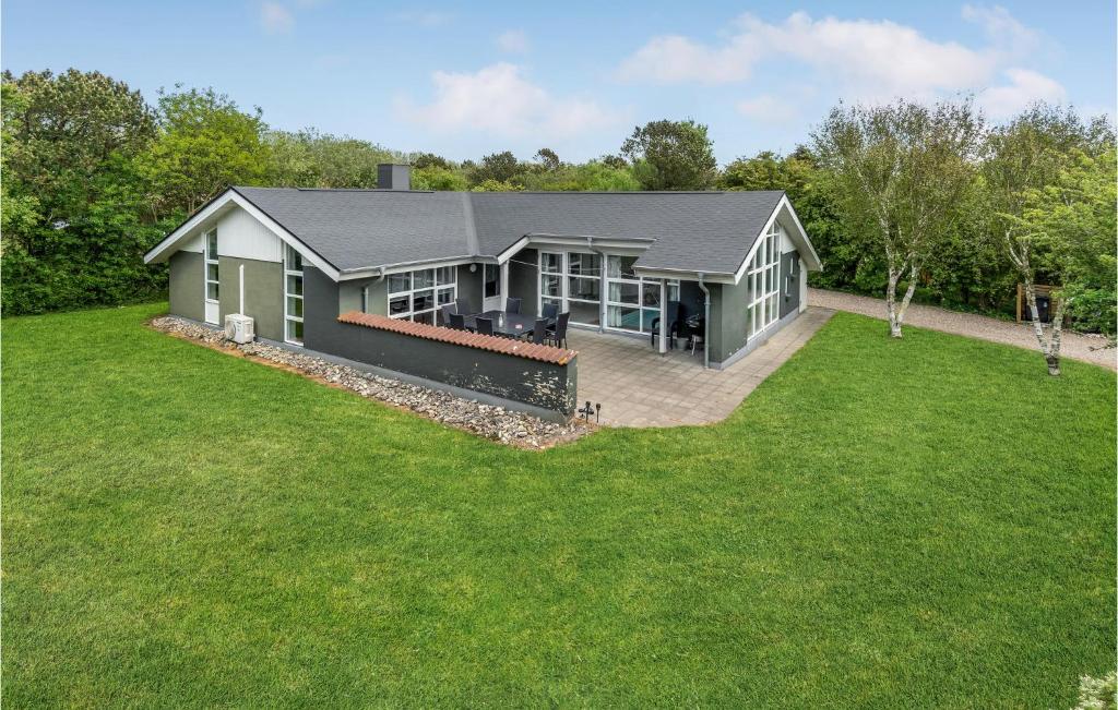 a house with a large lawn in front of it at 4 Bedroom Lovely Home In Vestervig in Vestervig