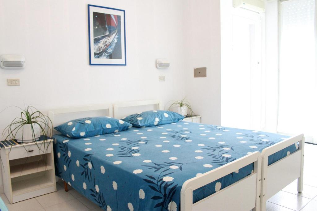Postel nebo postele na pokoji v ubytování Residence BluAdria
