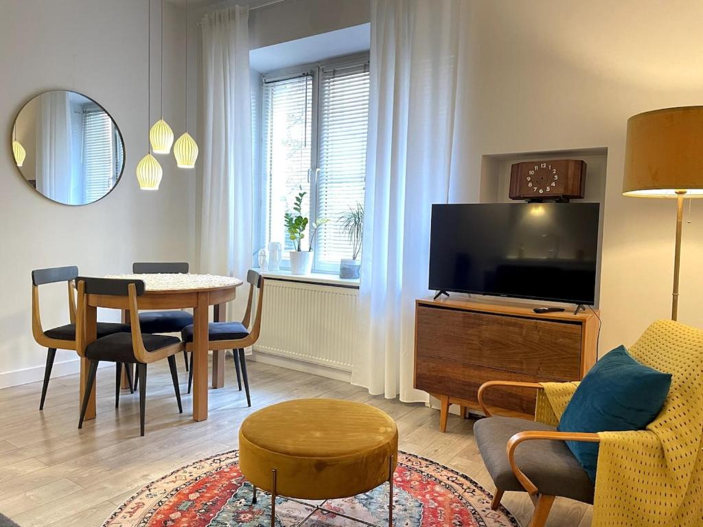 Televízia a/alebo spoločenská miestnosť v ubytovaní Snow White Apartment