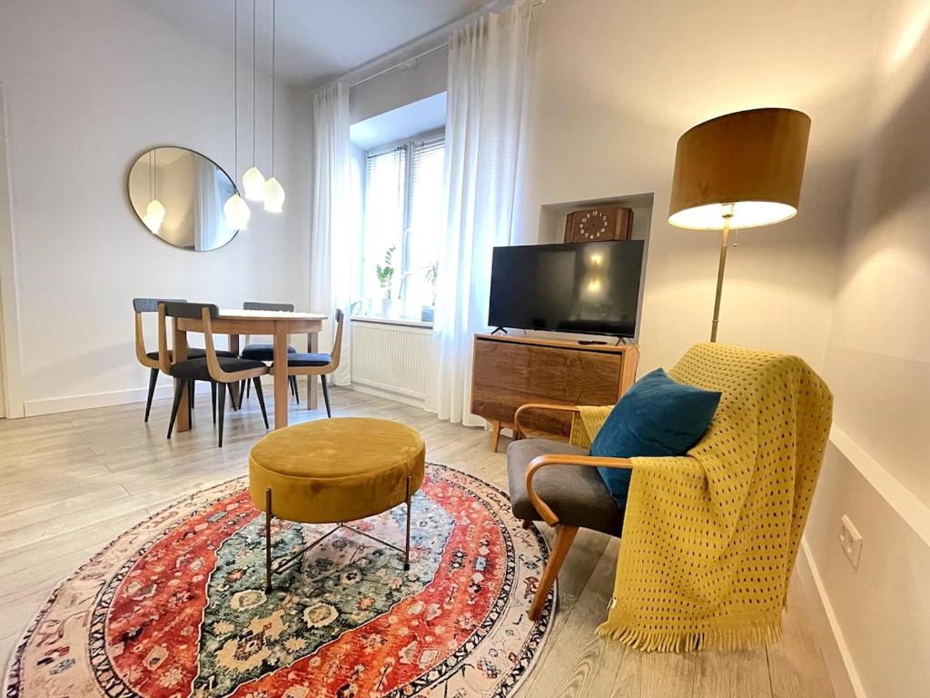Televízia a/alebo spoločenská miestnosť v ubytovaní Snow White Apartment