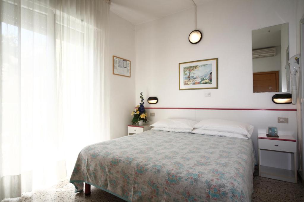 Postel nebo postele na pokoji v ubytování Hotel Lara
