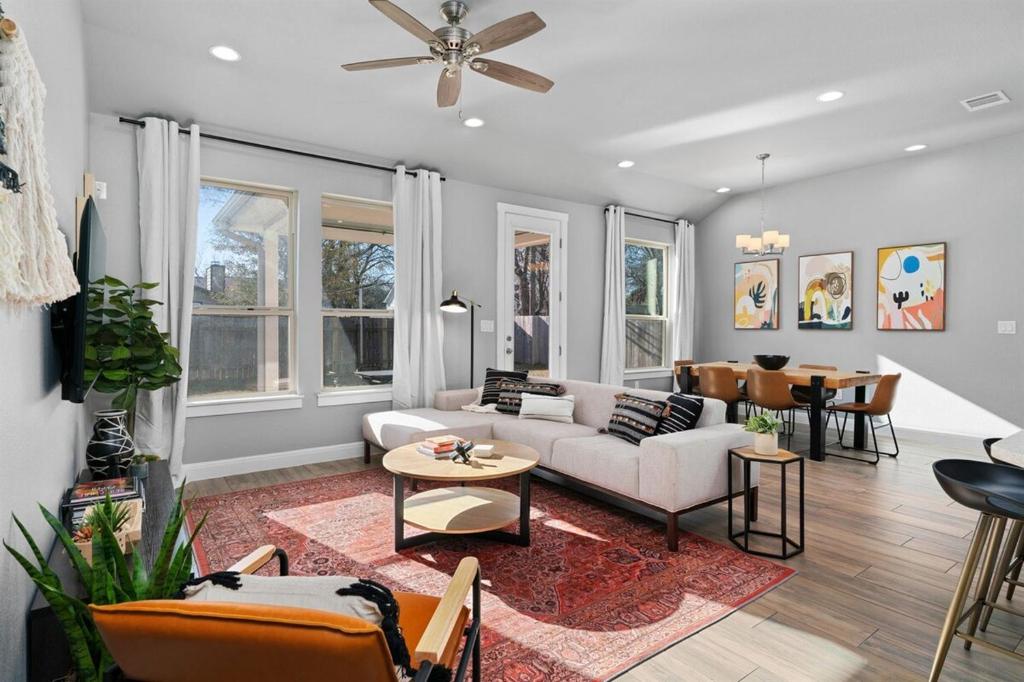 a living room with a couch and a table at LUXE Boho Chic5BR Woodbine Round Rock Kalahari in Round Rock