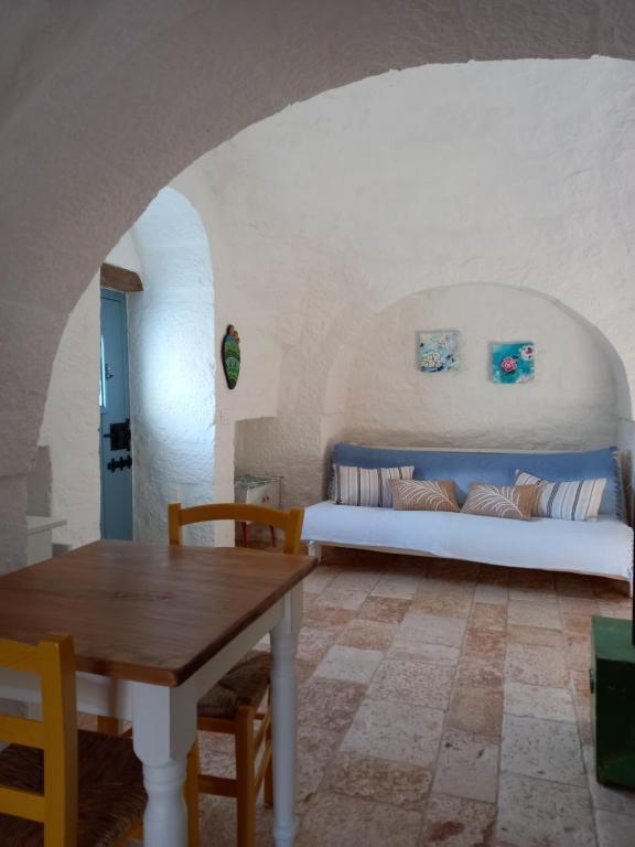 A bed or beds in a room at Trullo Margherita