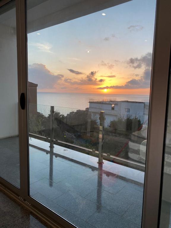 a view of the ocean from a window at Casa Klei in Ulcinj