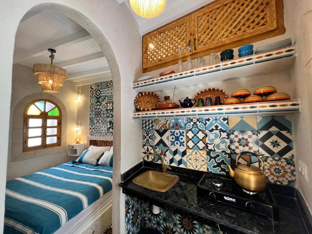 Postel nebo postele na pokoji v ubytování Riad dar Hania