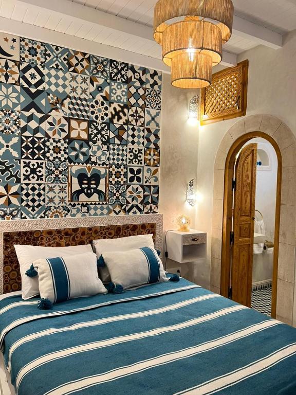 Postel nebo postele na pokoji v ubytování Riad dar Hania