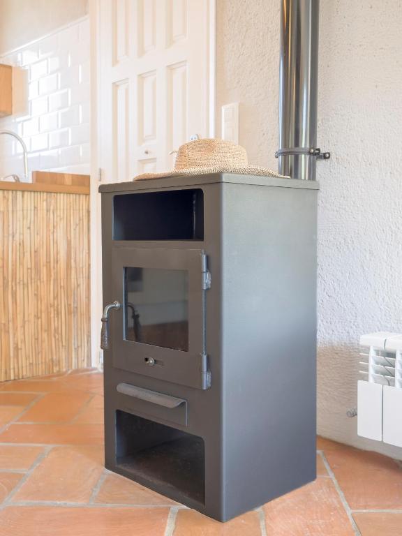 a kitchen with a counter with a stove at Villa Tosalet Pomelo in Jávea