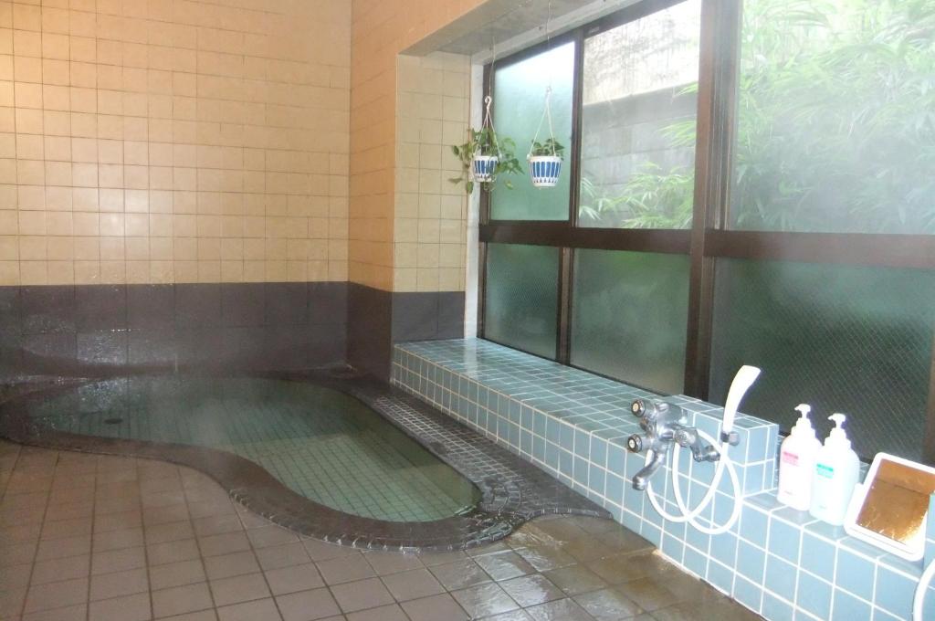 Kúpeľňa v ubytovaní Omiya Ryokan