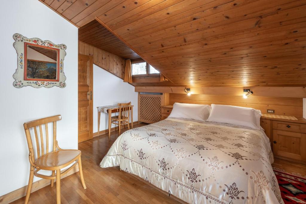 Postel nebo postele na pokoji v ubytování ATTICO Lodge
