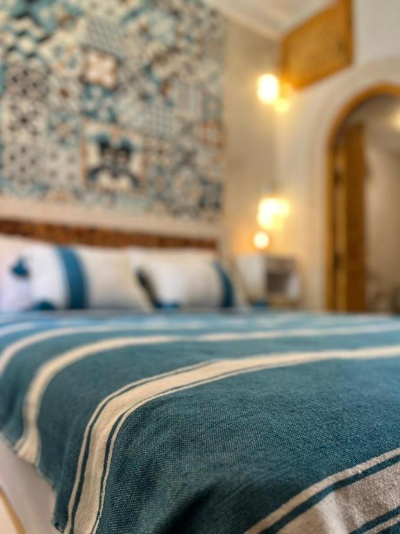 Postel nebo postele na pokoji v ubytování Riad dar Hania