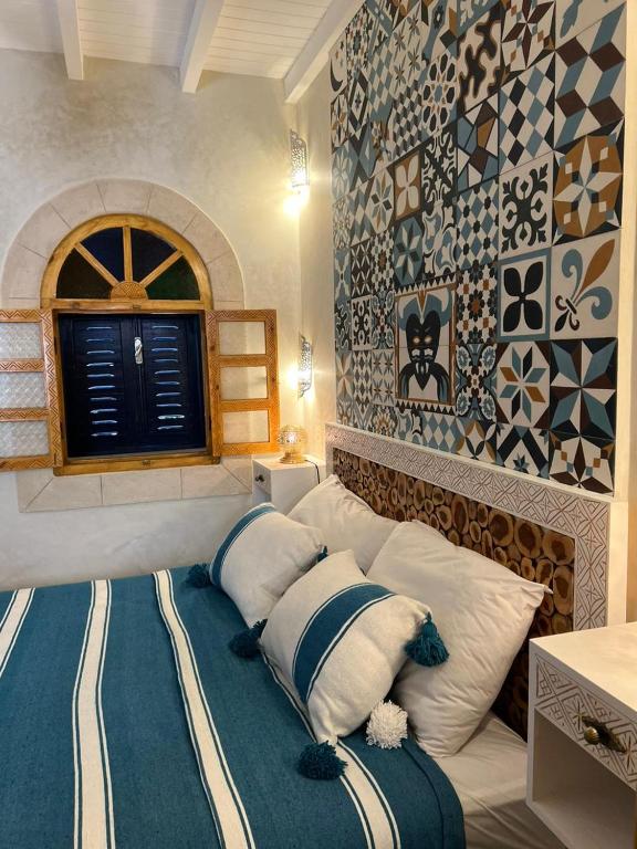 Postel nebo postele na pokoji v ubytování Riad dar Hania