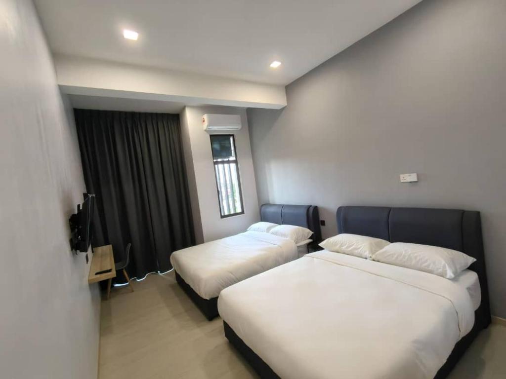 Postel nebo postele na pokoji v ubytování Room 2 U Hostel & Guest House