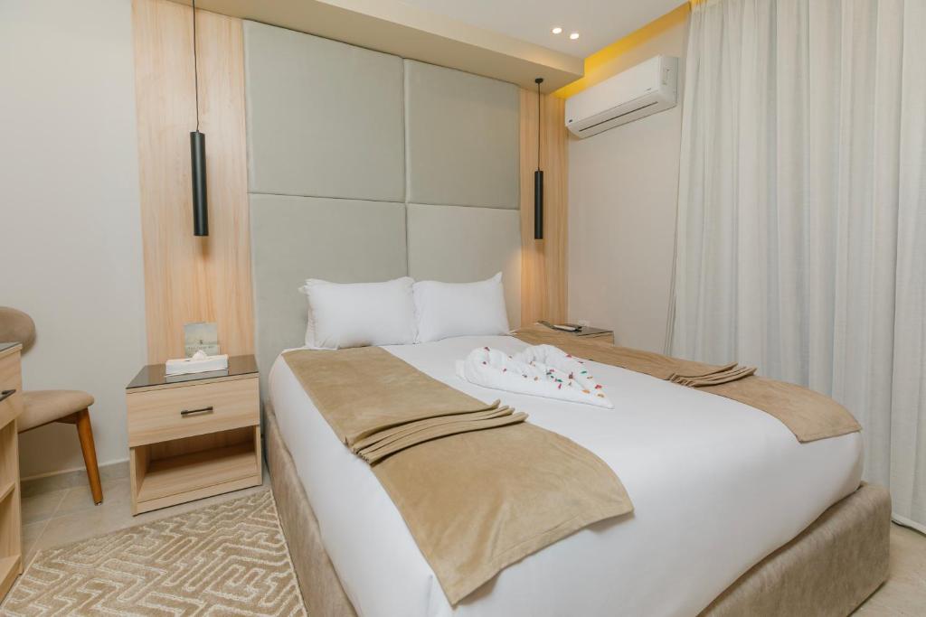 Postel nebo postele na pokoji v ubytování Tiye Pyramids Hotel