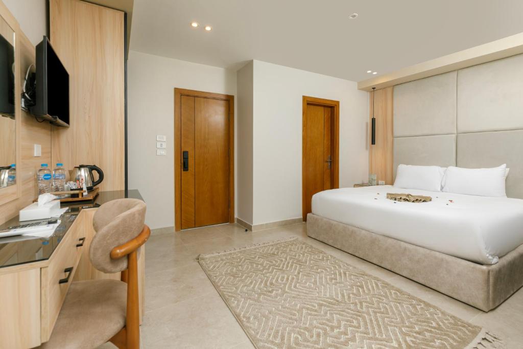 Postel nebo postele na pokoji v ubytování Tiye Pyramids Hotel