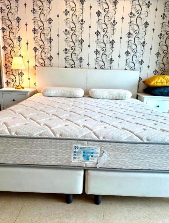 Postel nebo postele na pokoji v ubytování Centara Pattaya Apartment