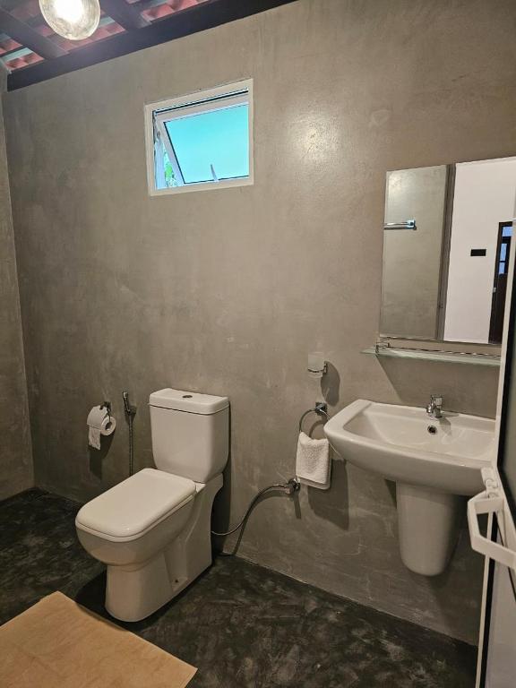 Koupelna v ubytování Muthu Hiriketiya