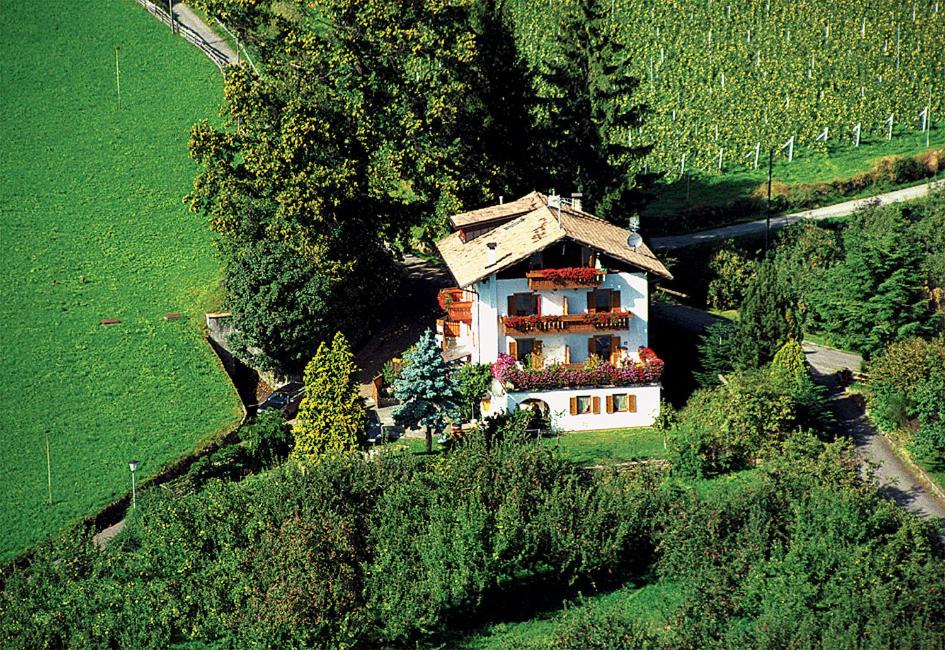 a house on the side of a hill at Appartements Sonnengarten in Tirolo