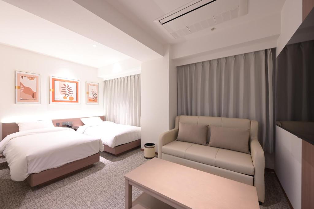 Postel nebo postele na pokoji v ubytování COCOYO Hotel 大塚