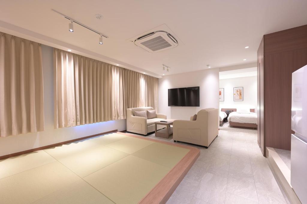 TV a/nebo společenská místnost v ubytování COCOYO Hotel 大塚