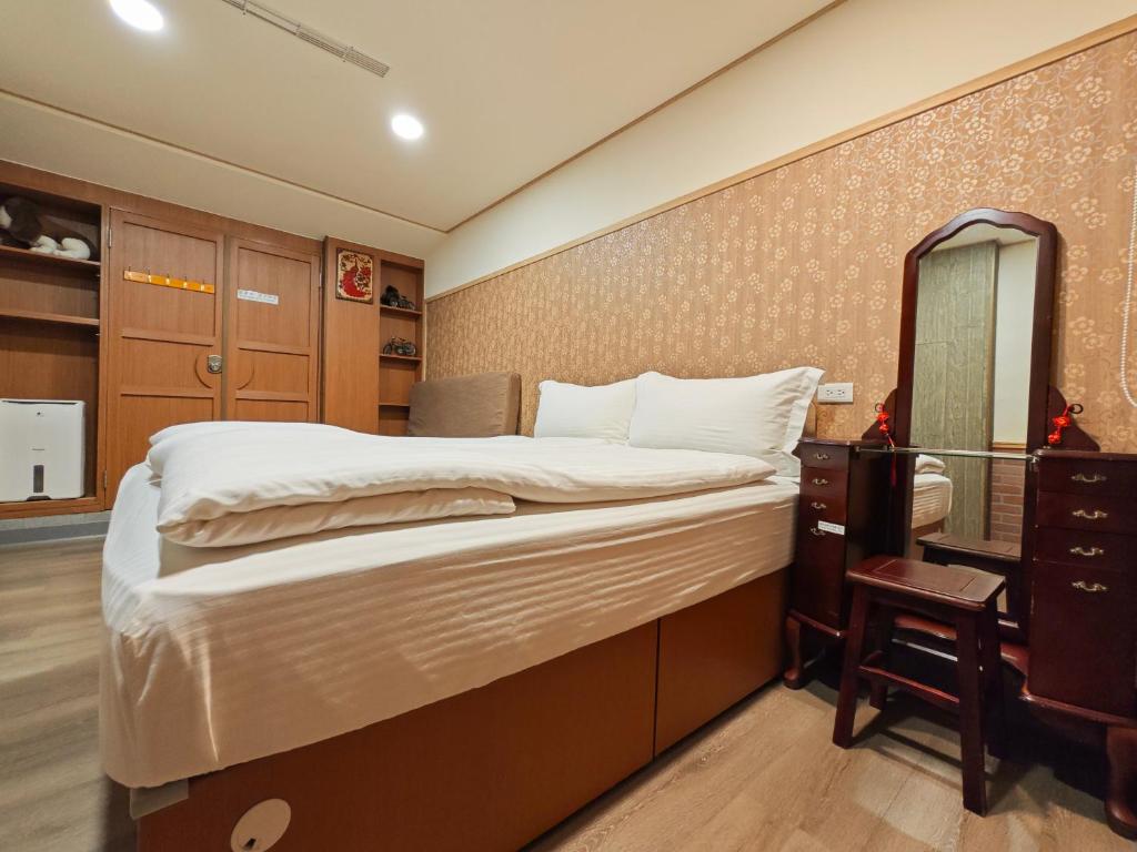 Postel nebo postele na pokoji v ubytování Qu Hi Home Stay