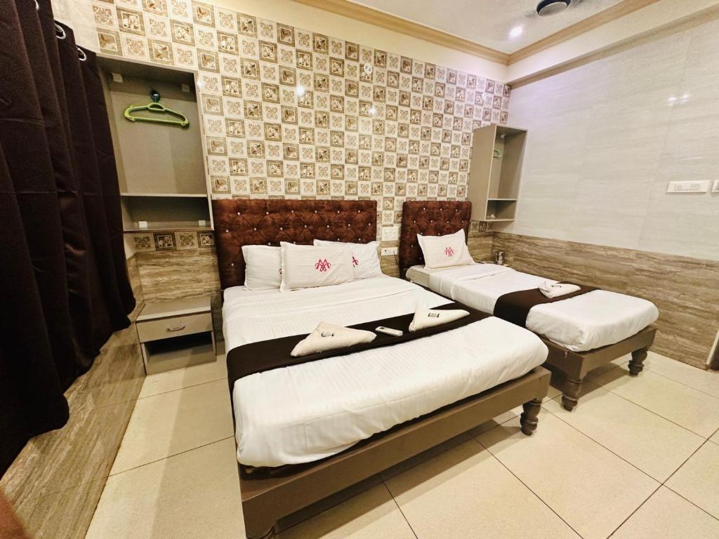 Postel nebo postele na pokoji v ubytování MARINA PALACE