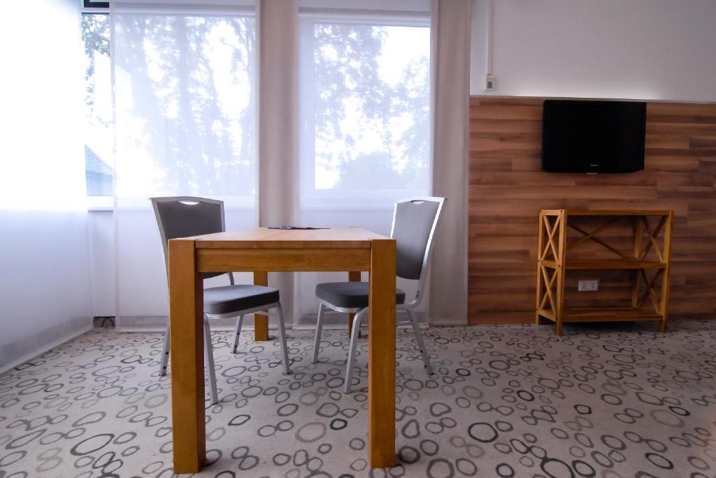 TV a/nebo společenská místnost v ubytování Petul Apart Hotel Am Ruhrbogen