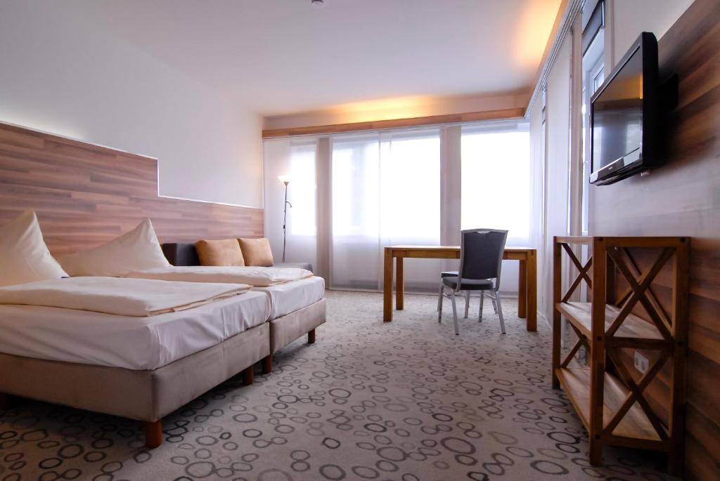 Postel nebo postele na pokoji v ubytování Petul Apart Hotel Am Ruhrbogen