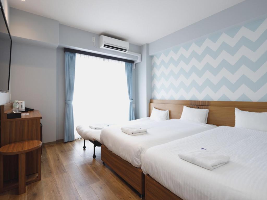 Postel nebo postele na pokoji v ubytování Five Hotel Osaka