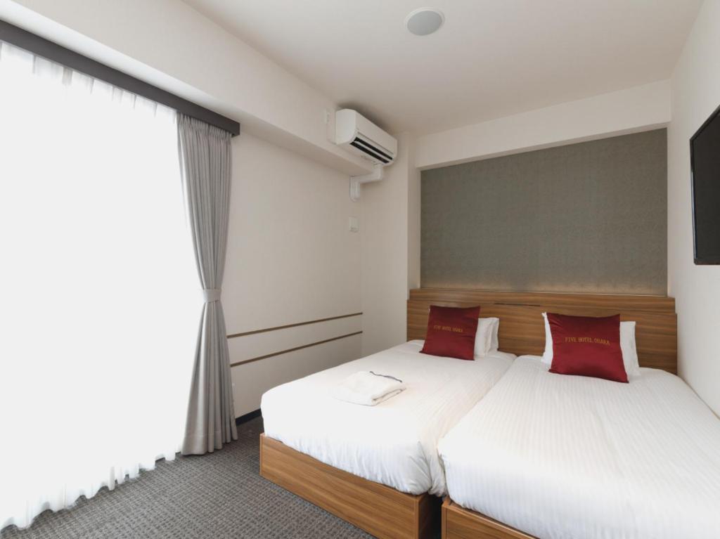Postel nebo postele na pokoji v ubytování Five Hotel Osaka