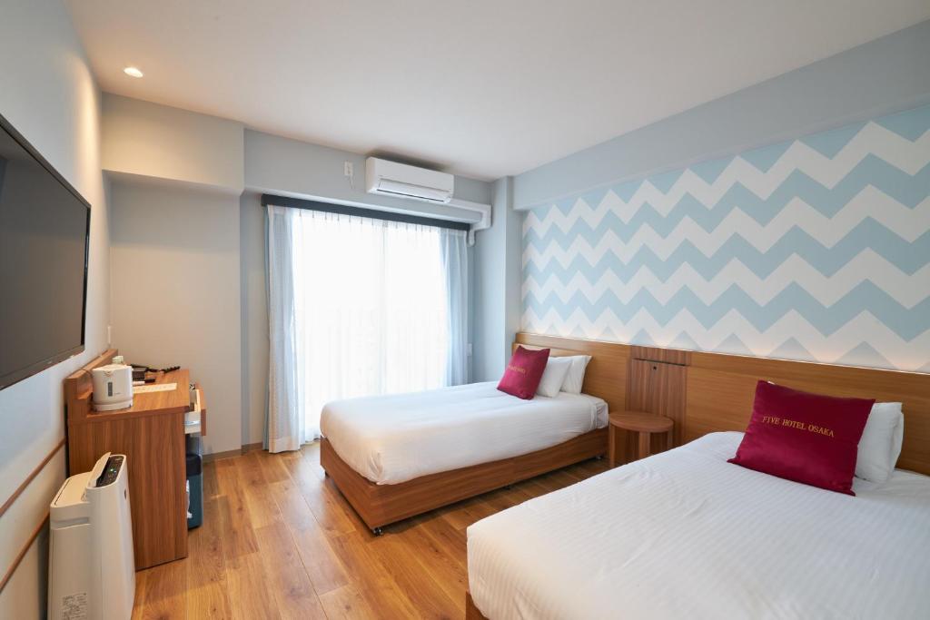 Postel nebo postele na pokoji v ubytování Five Hotel Osaka