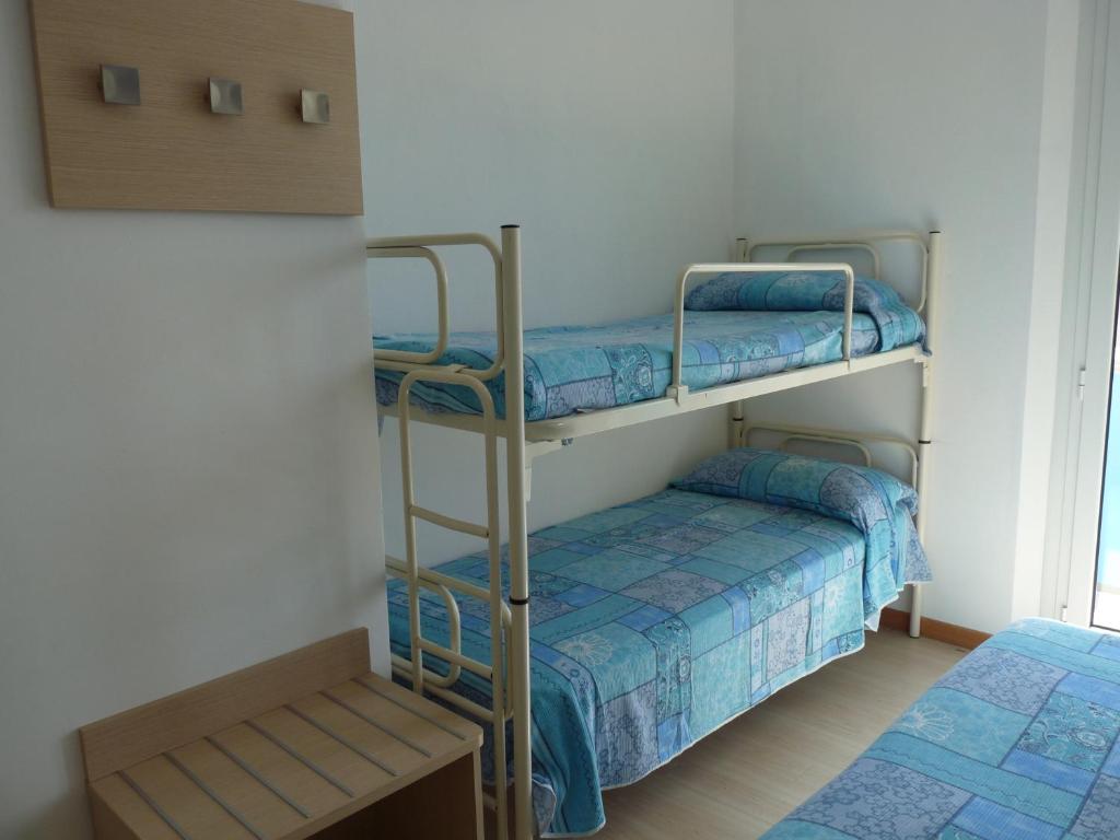Postel nebo postele na pokoji v ubytování Hotel Haarlem