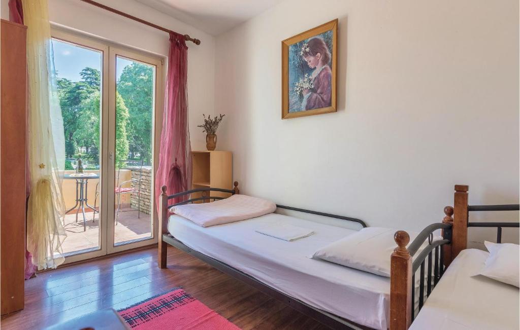 Postel nebo postele na pokoji v ubytování Cozy Apartment In Pula With Wifi