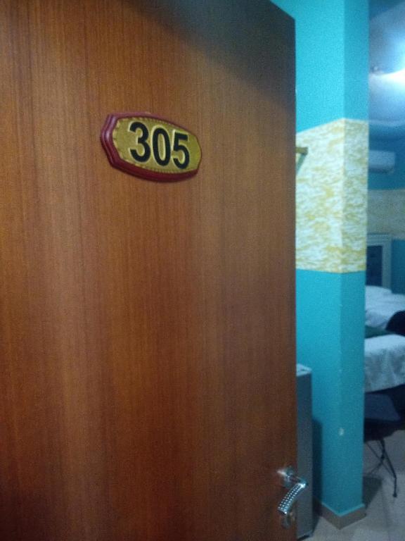 Postel nebo postele na pokoji v ubytování Prince Hotel Fier