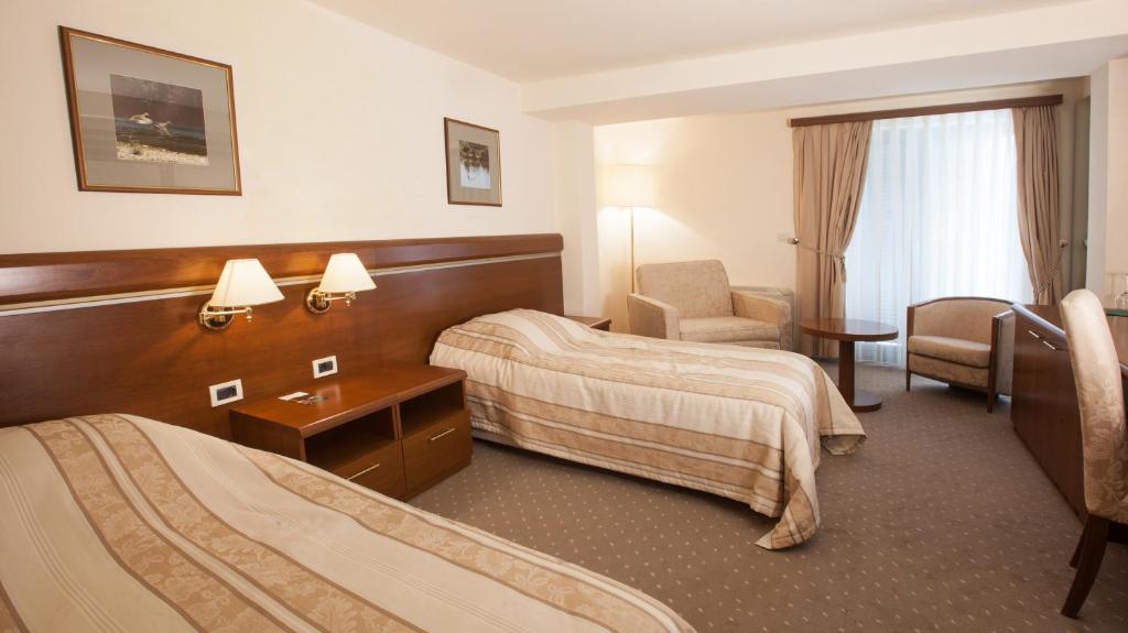 Postel nebo postele na pokoji v ubytování Hotel Stari Podrum