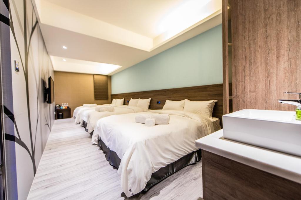 Postel nebo postele na pokoji v ubytování SIX FUKUN HOTEL