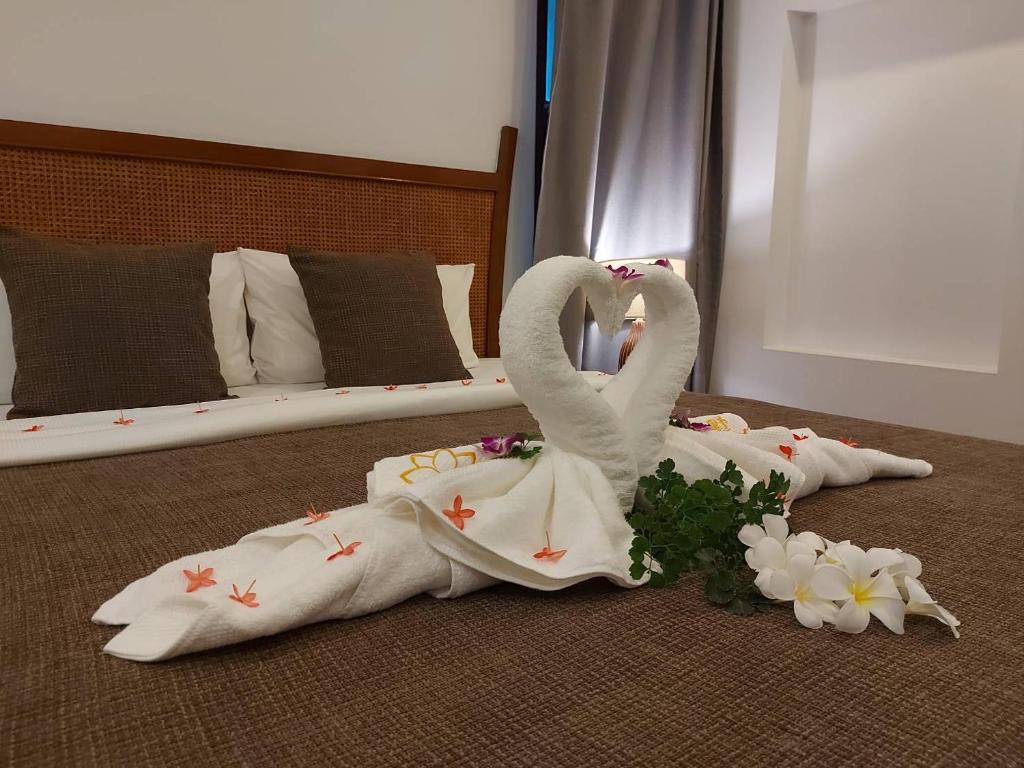 Postel nebo postele na pokoji v ubytování begonia N7 villa resort海棠7号别墅酒店