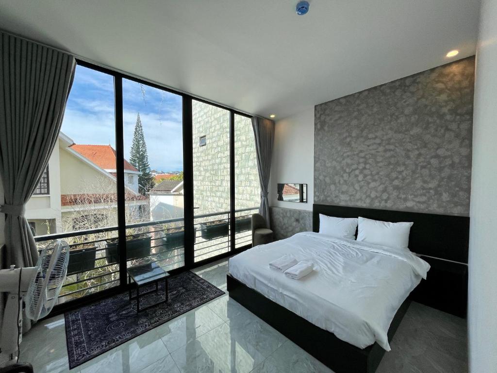 Postel nebo postele na pokoji v ubytování Ben Ben Hotel