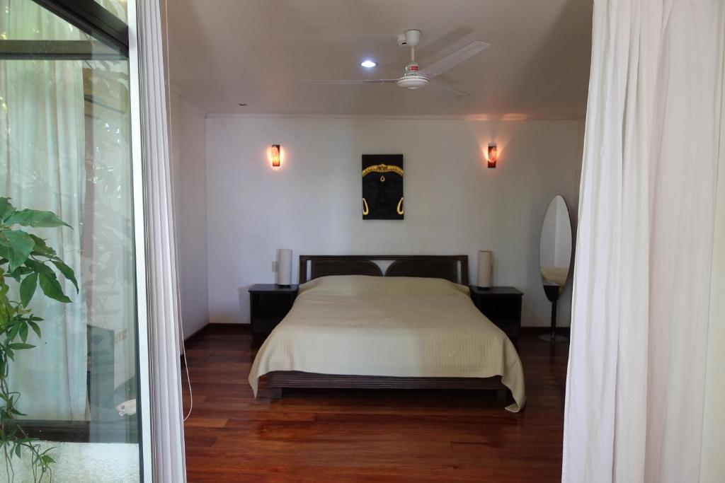Postel nebo postele na pokoji v ubytování Argonauta Boracay Apartment Suites and Villas