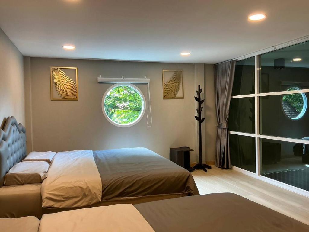 En eller flere senge i et værelse på Lajida pool villa