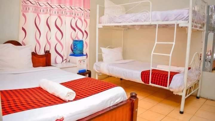 Postel nebo postele na pokoji v ubytování Homebase gardens hotel & safaris