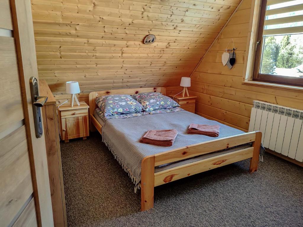 Postel nebo postele na pokoji v ubytování Bieszczadzka Ostoja