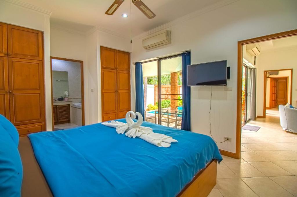 Postel nebo postele na pokoji v ubytování VIEW TALAY VILLAs POOL 155, JOMTIEN BEACH, PATTAYA