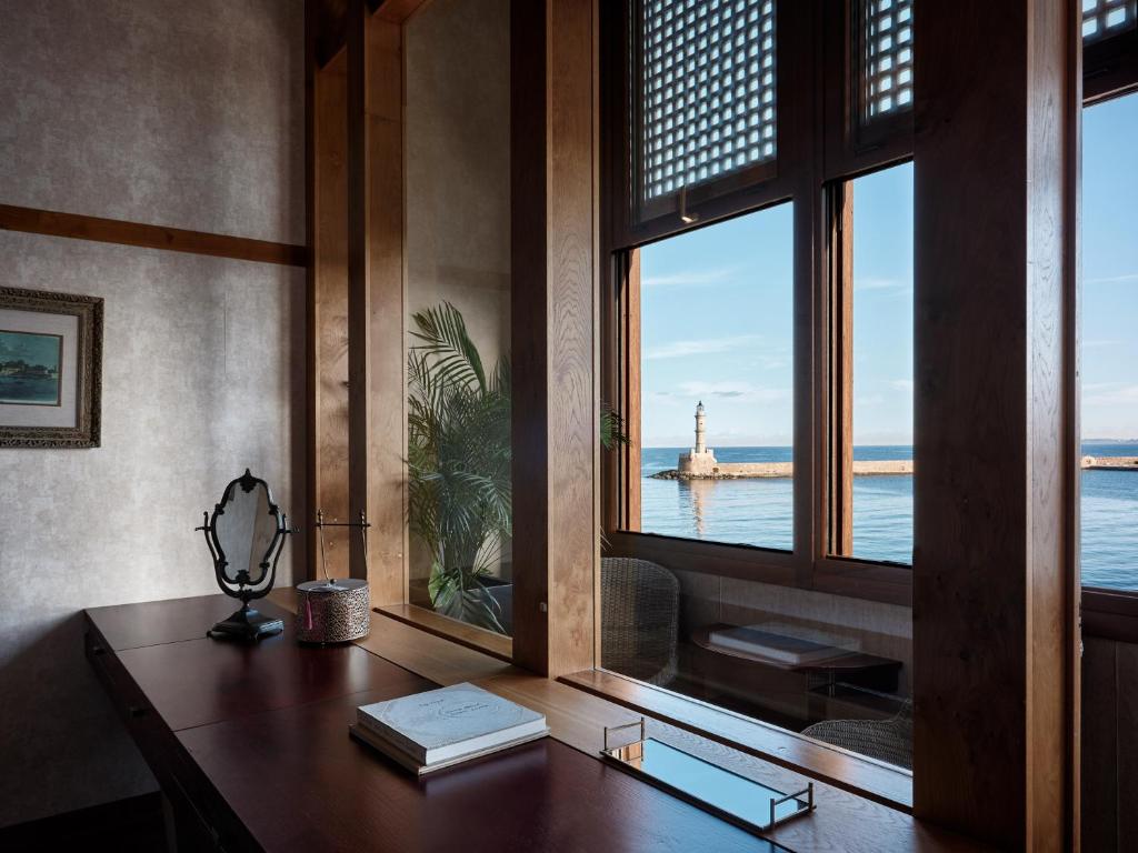 an office with a desk with a view of the ocean at Domus Renier Boutique Hotel in Chania Town