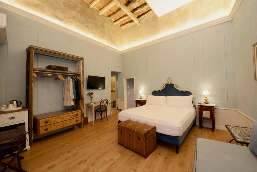 Postel nebo postele na pokoji v ubytování Heritage Collection Palermo B&B