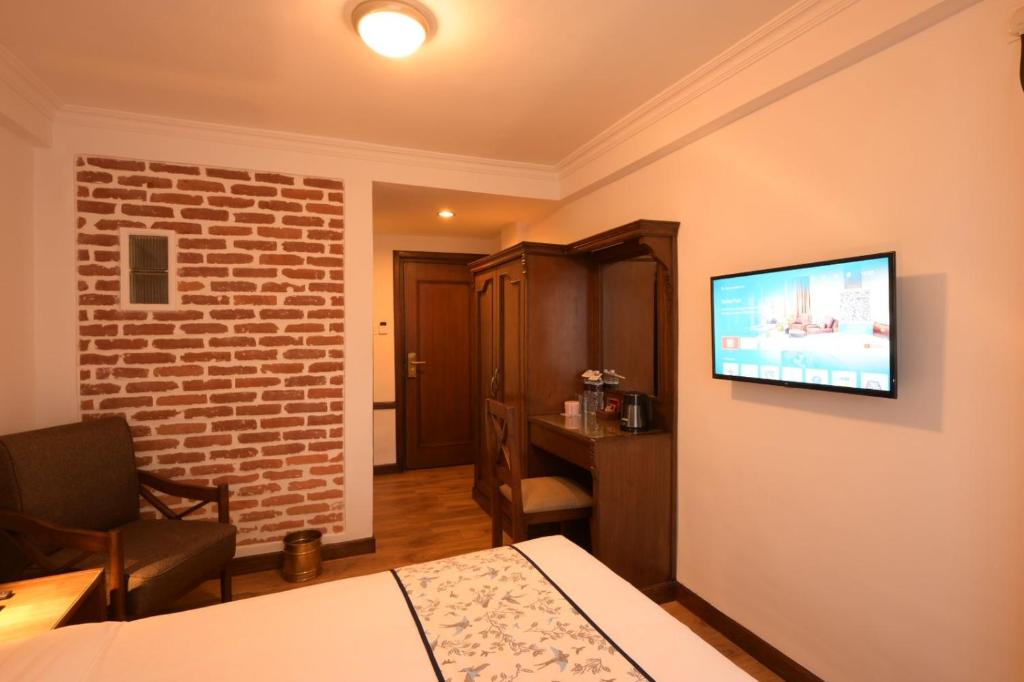 TV a/nebo společenská místnost v ubytování Gallery Park Hotel