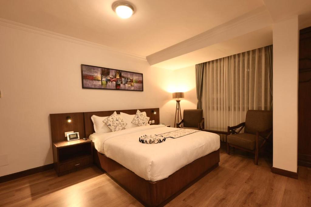 Postel nebo postele na pokoji v ubytování Gallery Park Hotel