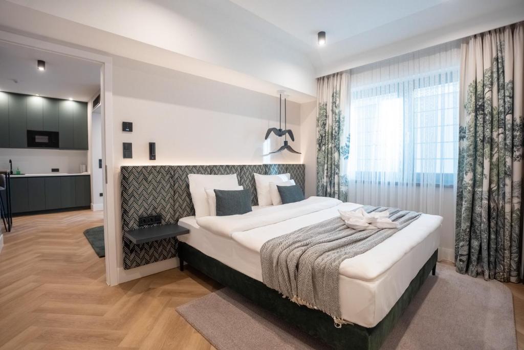 Voodi või voodid majutusasutuse Larum Balatonfüred - Adults only toas