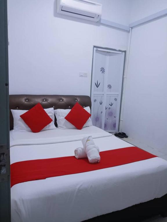 Voodi või voodid majutusasutuse Max Ferringhi Hotel toas
