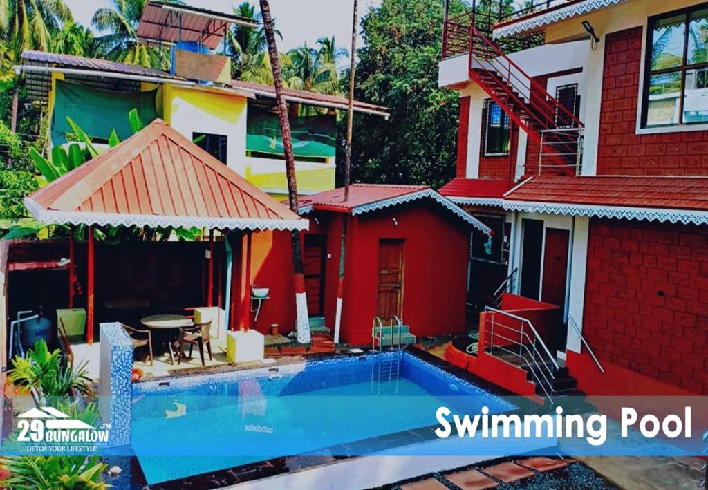 ein Haus mit einem Swimmingpool davor in der Unterkunft Sea dreamz villa BY 29 BUNGALOW in Alībāg